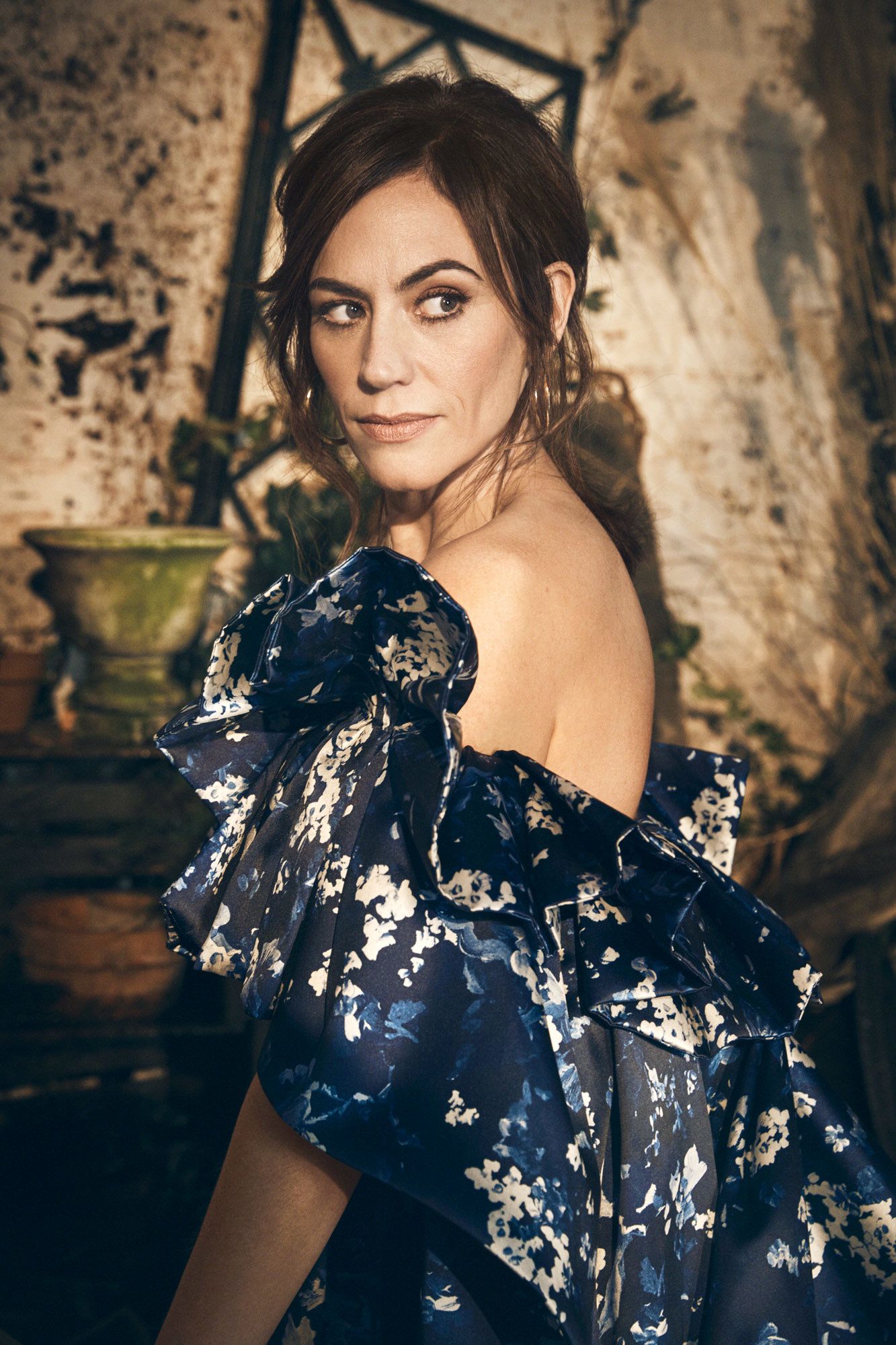 Maggie Siff in a blue floral gown.