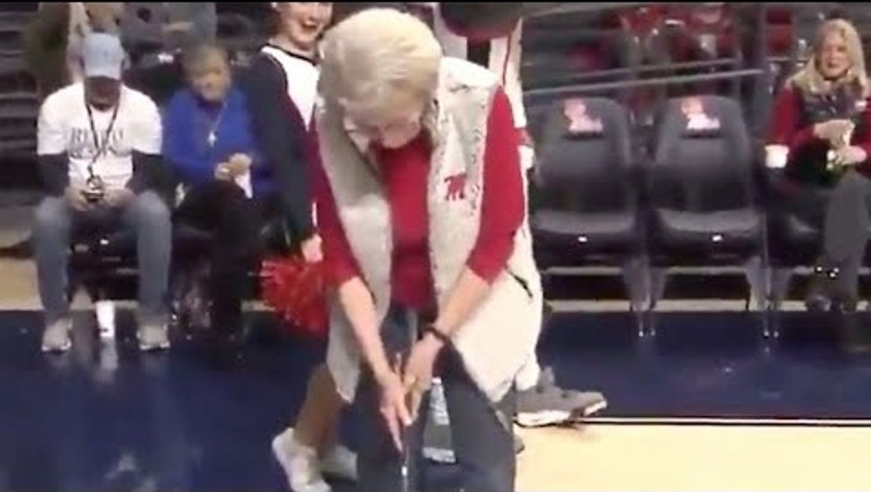 Watch this 86-year-old grandma sink a 94-foot putt to win a free car at Ole Miss-Bama basketball game