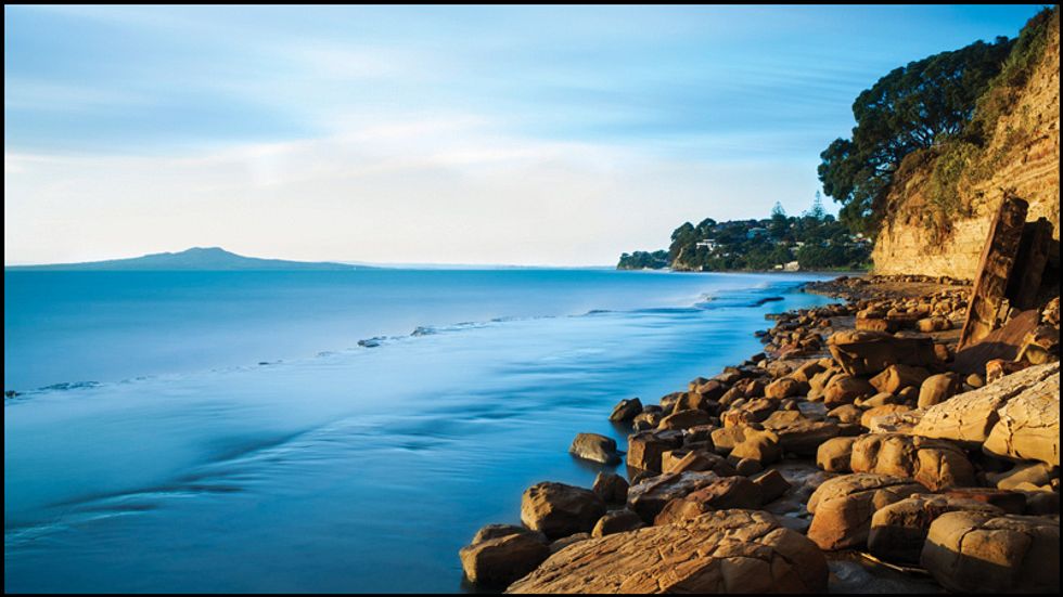 A rocky stone beach close to the city.