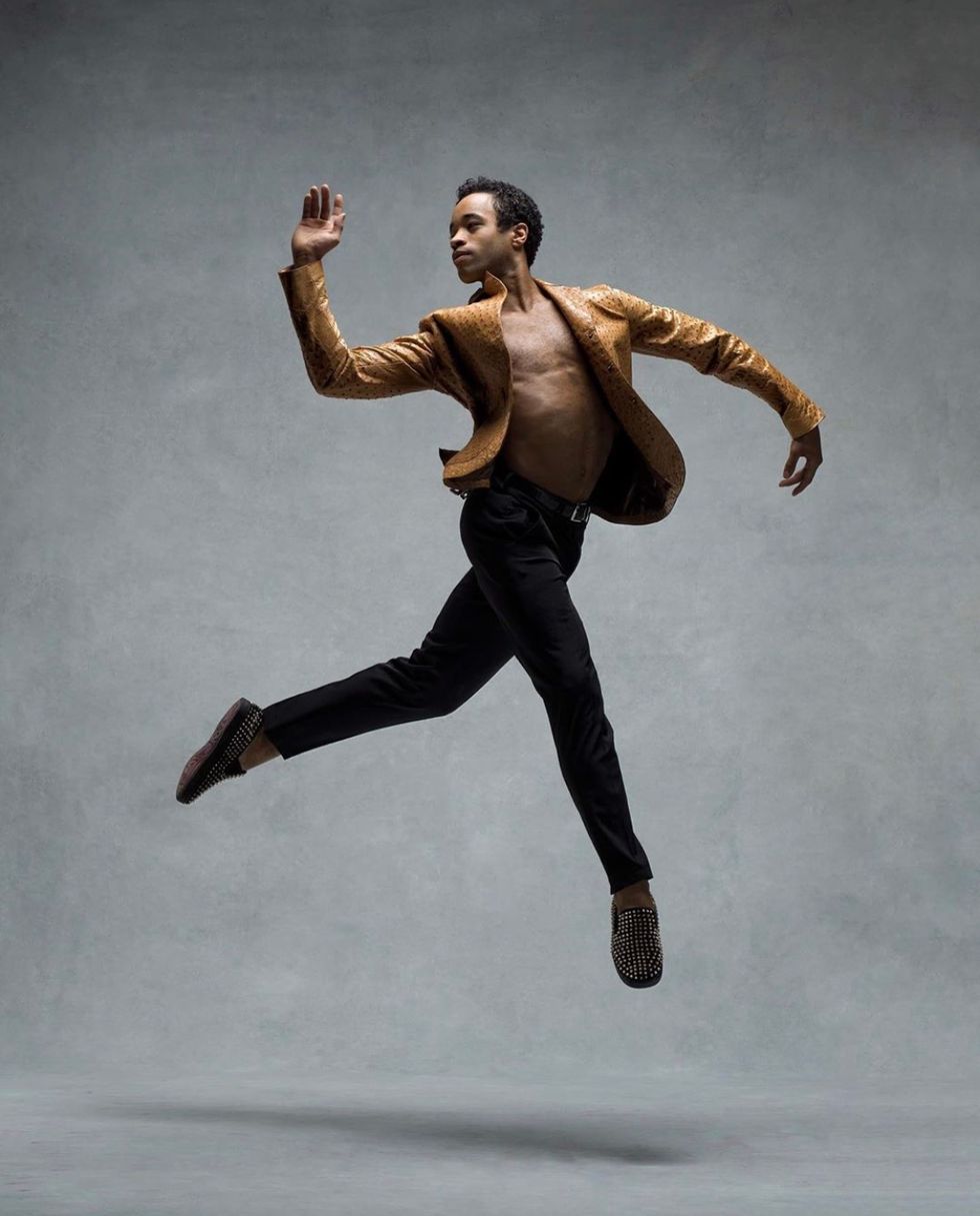 Gabe Stone Shayer leaps easily on a grey backdrop