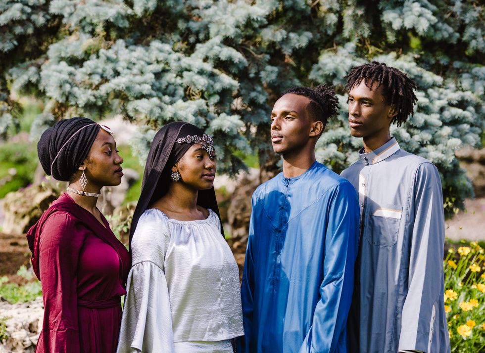Young Africans posed together in traditional dress.