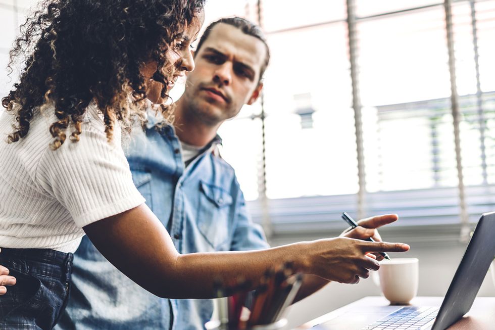 Man and woman are trying not to be control freaks at work