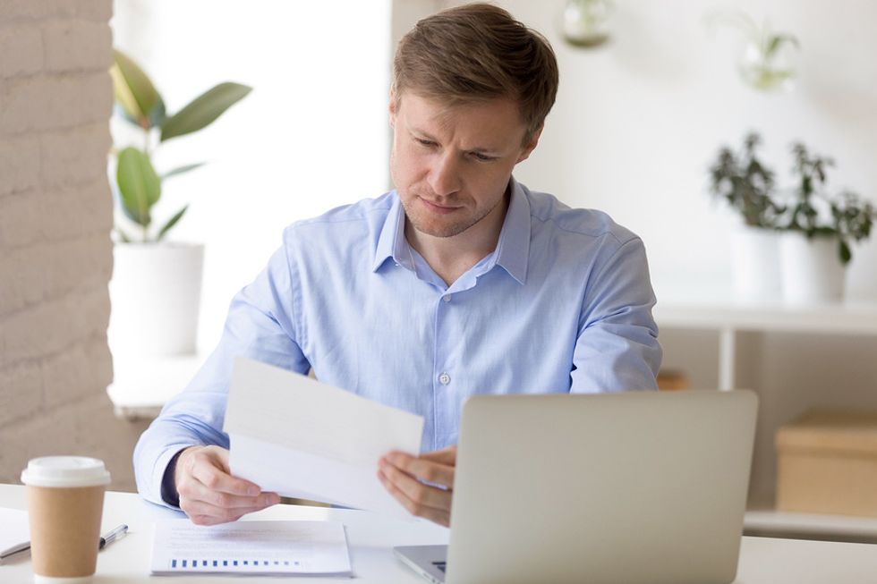Man updates his resume before updating his LinkedIn profile