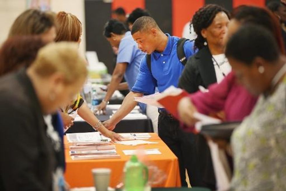 U.S. Jobless Claims Fall To Eight-Year Low