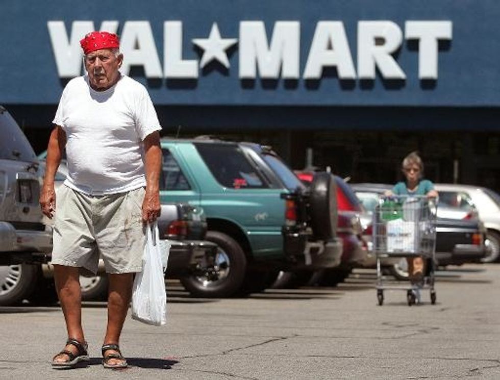 Wal-Mart Cuts Profit Forecast As It Gears Up E-Commerce
