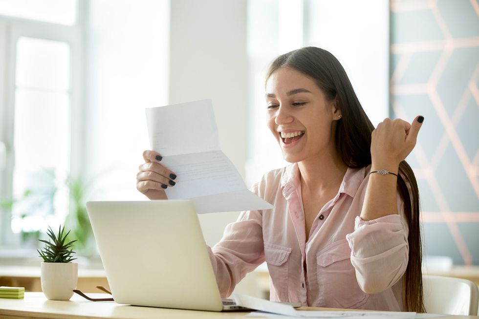 Woman receives a thank you note from her manager on Employee Appreciation Day