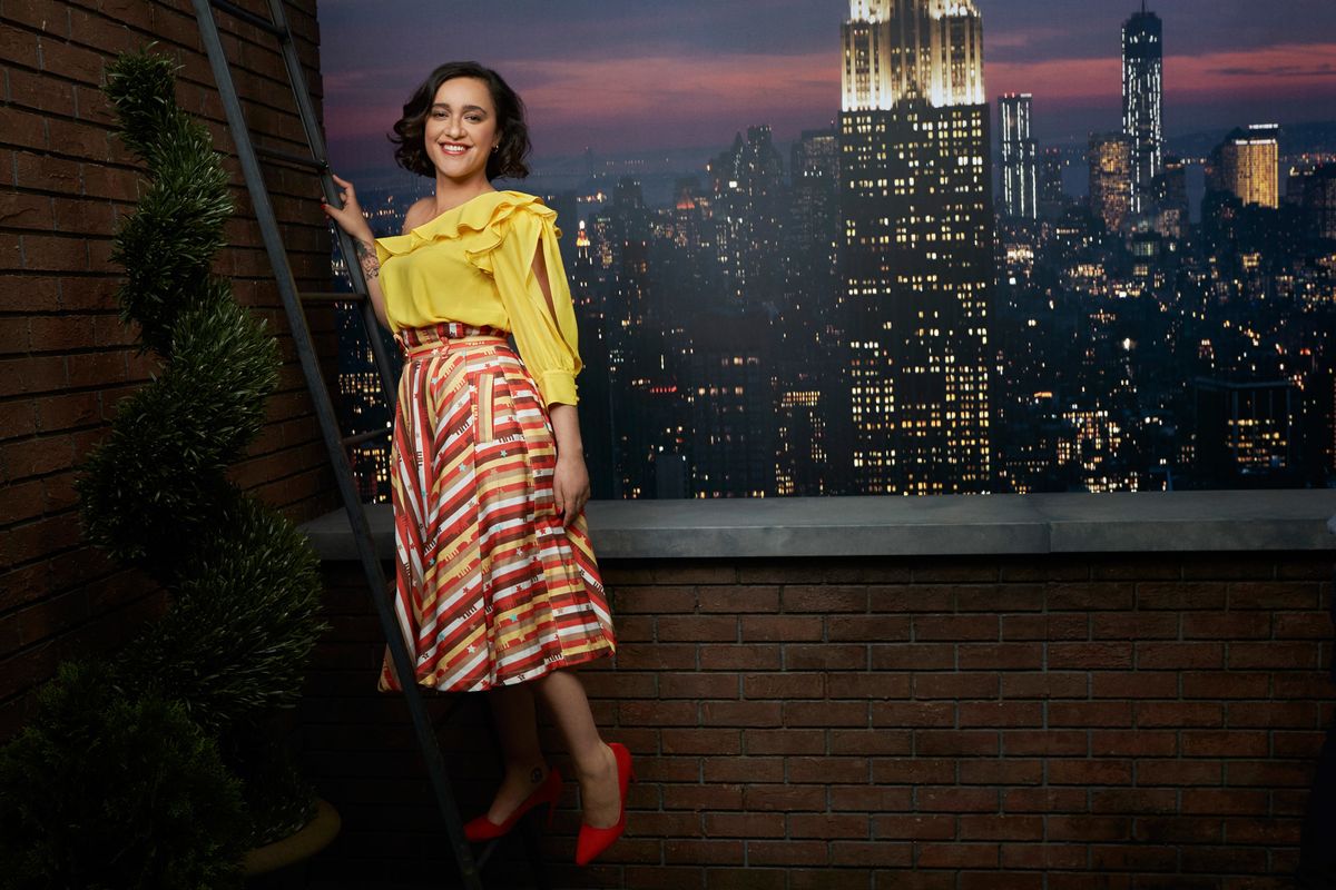 Keisha Castle-Hughes posing in front of a Manhattan skyline backdrop.