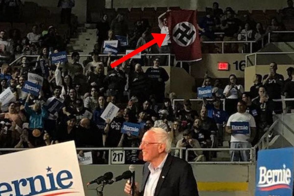 A white supremacist unfurled a giant Nazi flag and yelled 'Heil Hitler' at a Bernie Sanders rally