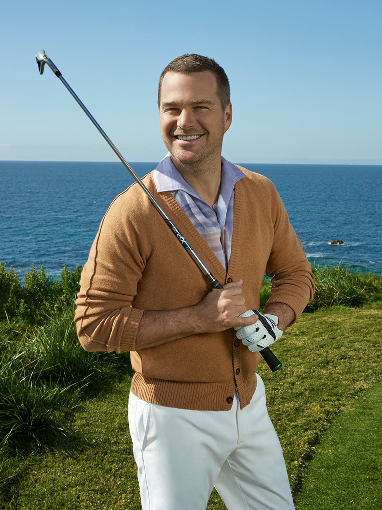 Chris ODonnell of NCIS Los Angeles holding a golf club