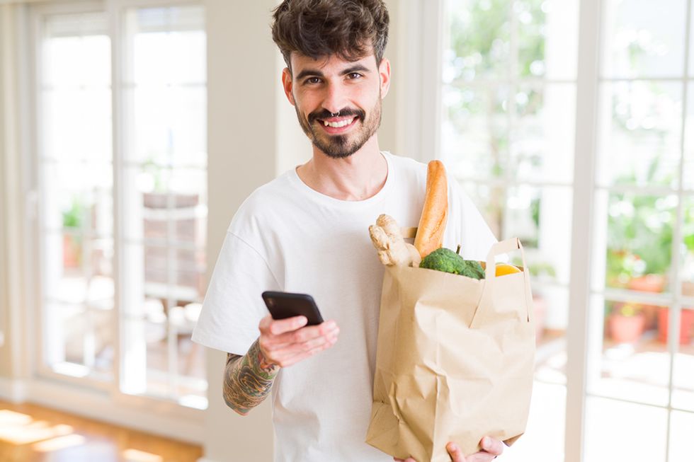 Man buys groceries for meal prep