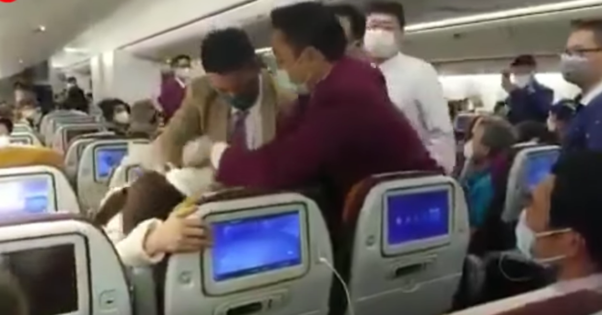 Crew Tackles Chinese Woman After She Freaked Out About Being Delayed And 'Deliberately' Coughed On A Flight Attendant To Spark Panic