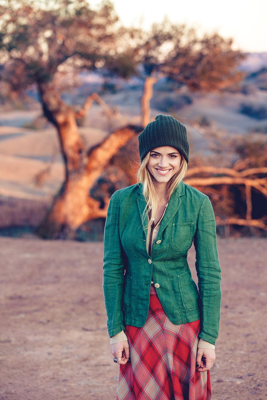 Emily Wickersham in green jacket and black beanie