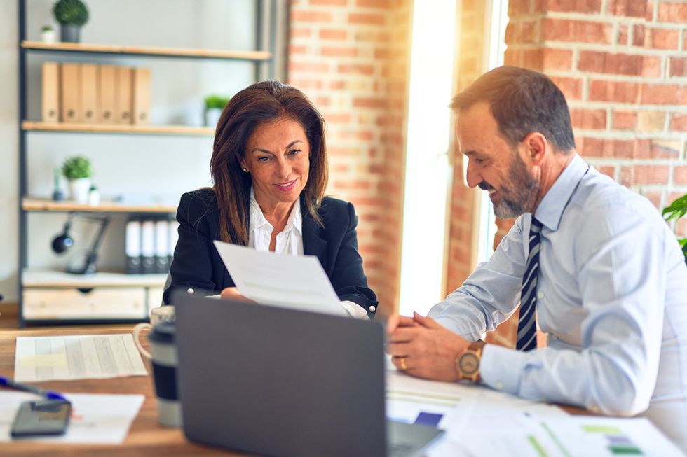 Woman shows a report to her new boss