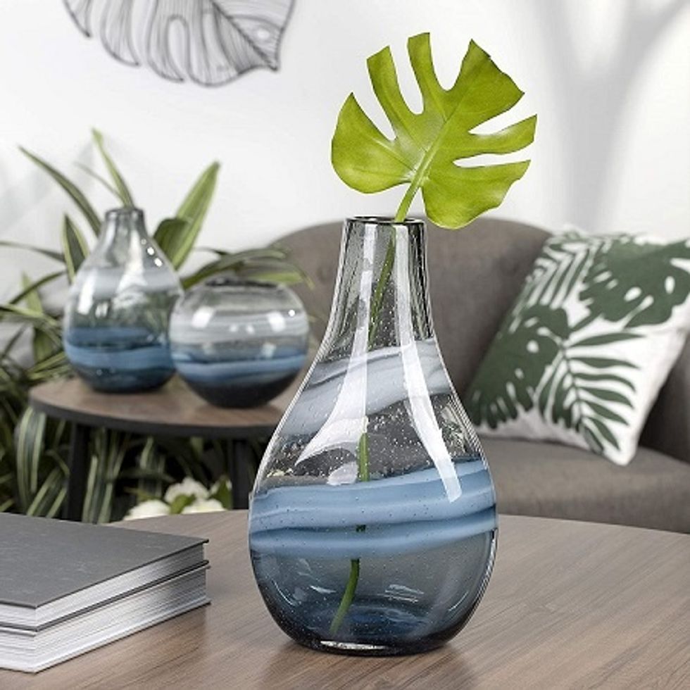 blue and black clear vase represents the water element