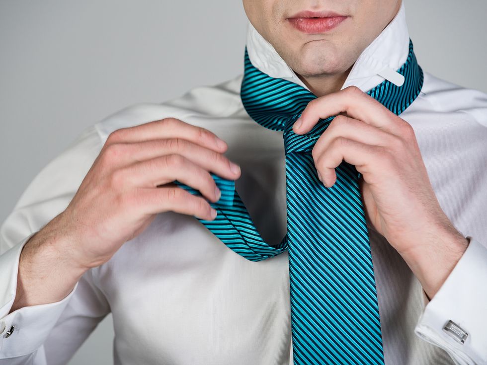 Man gets dressed for a virtual job interview