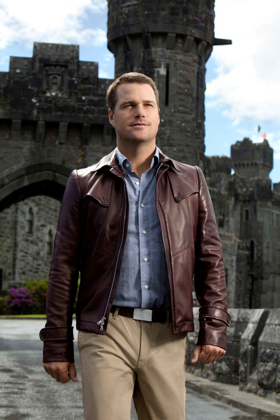 Chris O'Donnell on the grounds of a medieval castle.
