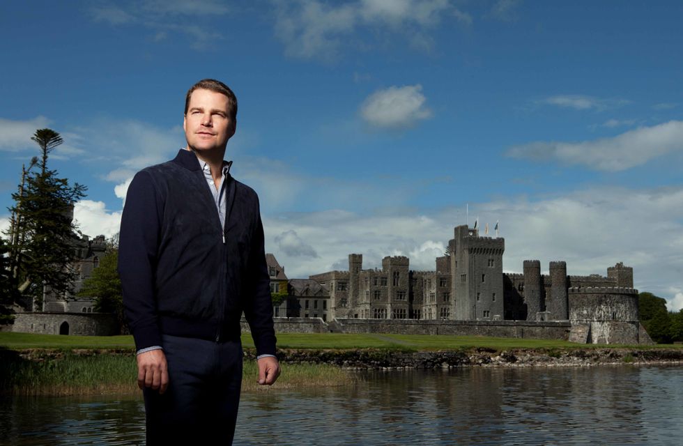 Chris O'Donnell in front of a famous castle