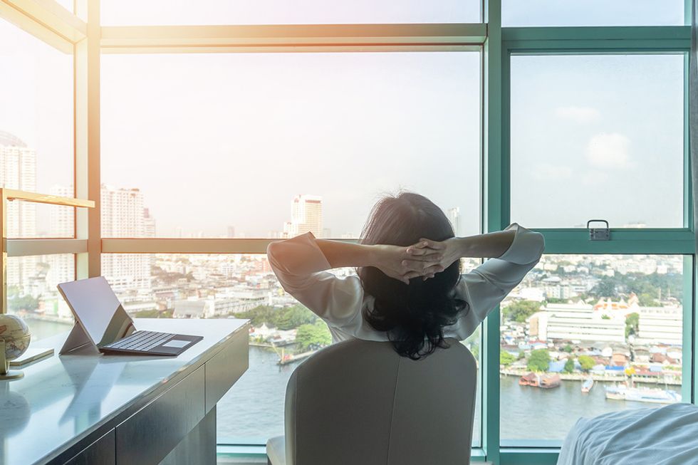 Woman works from home while balancing her career during a personal crisis.