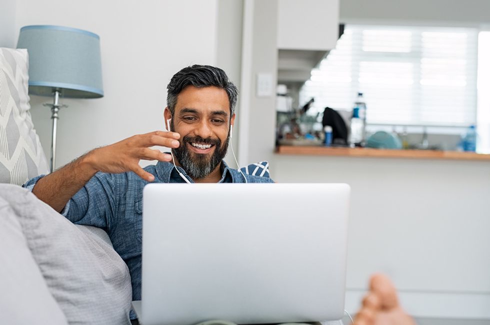 Man meets with his team virtually during the COVID-19 pandemic