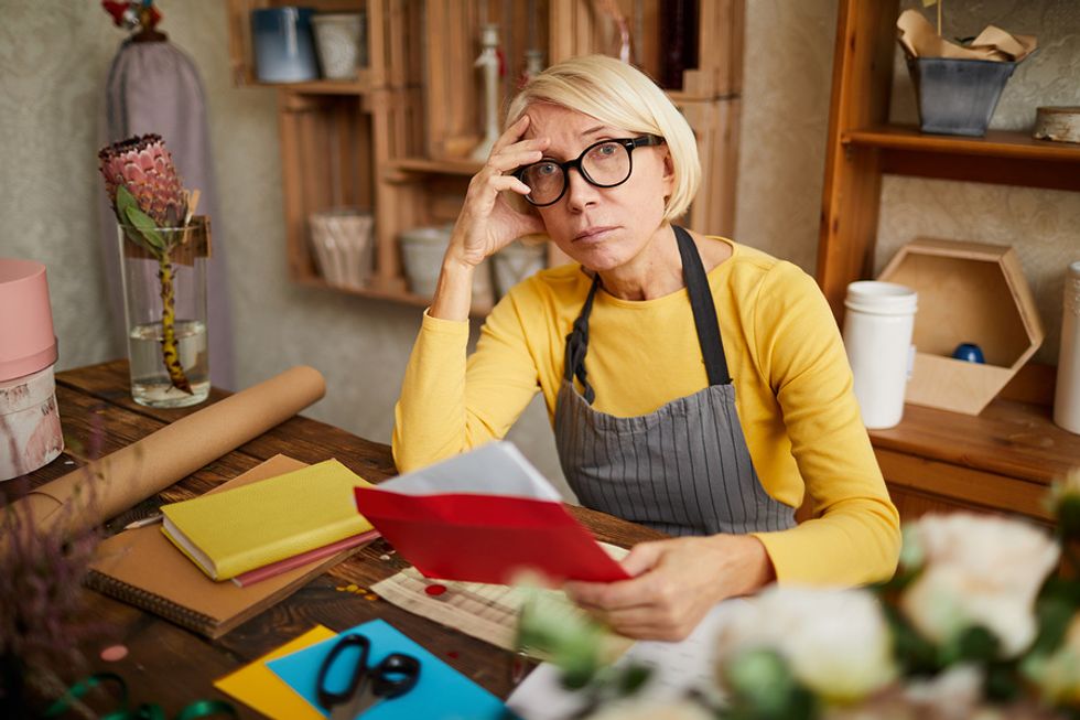 Woman stressed about doing taxes for her digital business