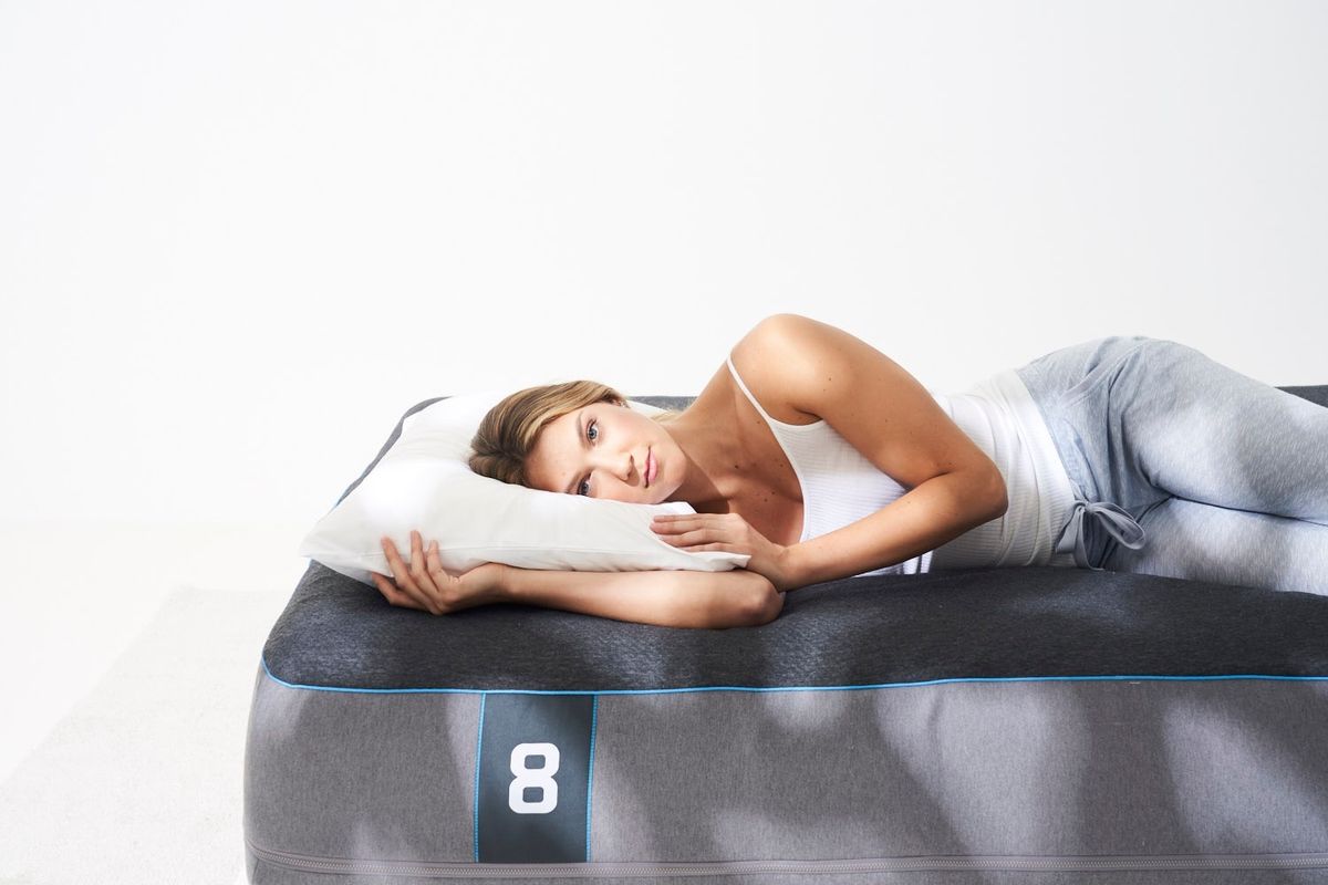 woman lying on 8 sleep mattress