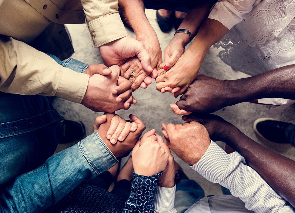 A group of co-workers work together to get through a tough time.