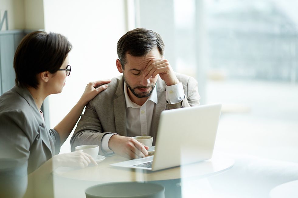 A manager consoles an employee during a time of need.