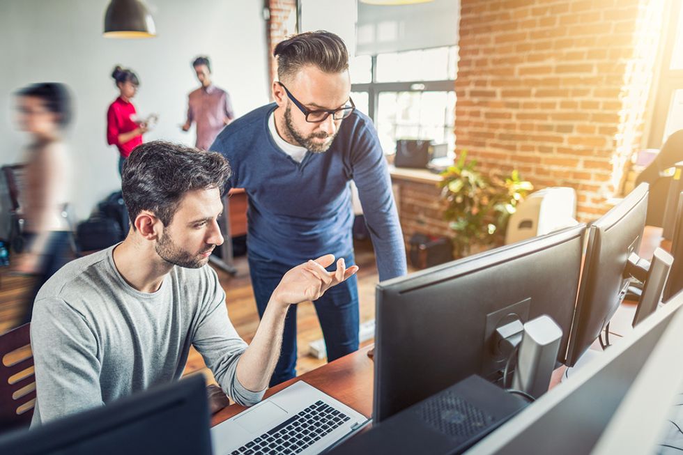 Two software engineers discuss a new product