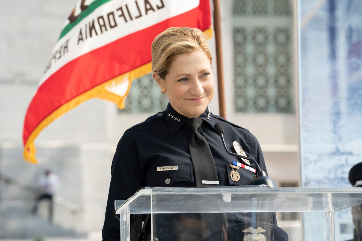 Edie Falco in a police uniform.