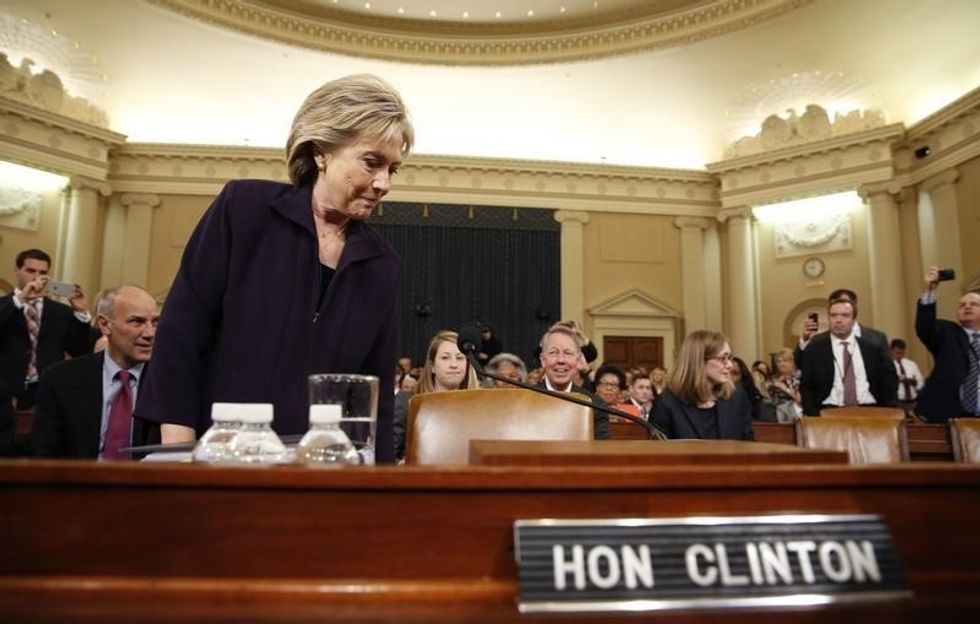 A Clinton Trial Under House Fire Again