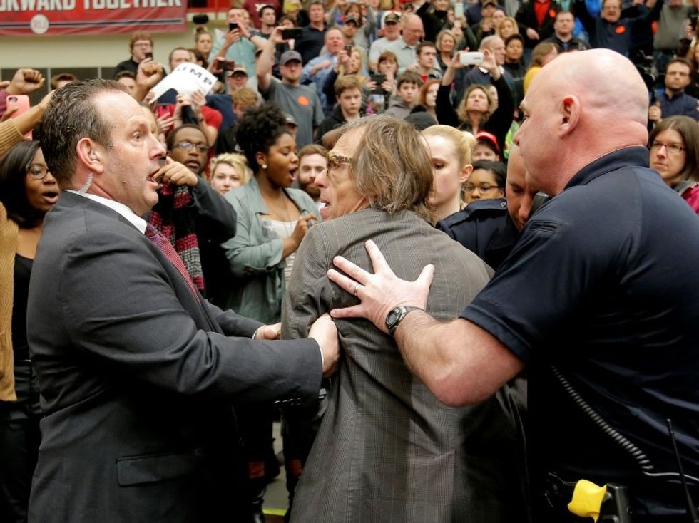Hecklers Disrupt Trump Rally, Photographer Shoved To The Ground