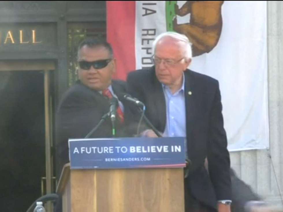 WATCH: Activists Rush Sanders On Stage, Secret Service Steps In