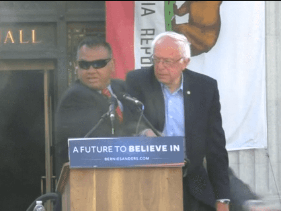 WATCH: Activists Rush Sanders On Stage, Secret Service Steps In