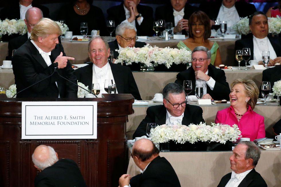 As Clinton Smiles, Trump Draws Jeers At Tense Al Smith Dinner