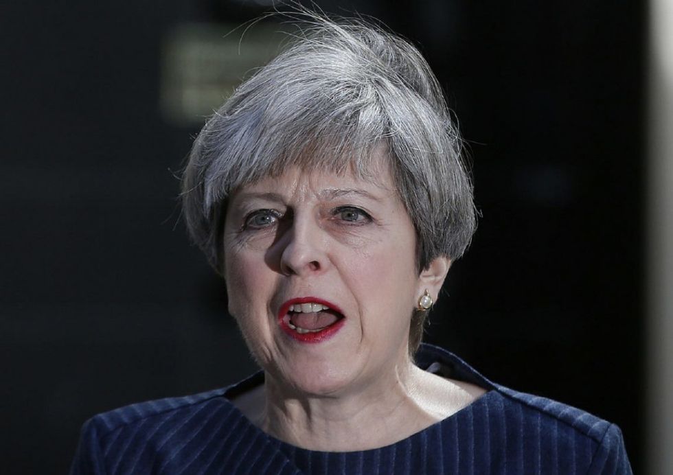 Under Pressure To Quit After Election Loss, May Will Try To Form Coalition