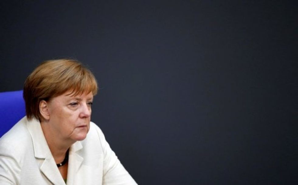 After Trashing Germany At Summit, Trump Greets Merkel Meekly