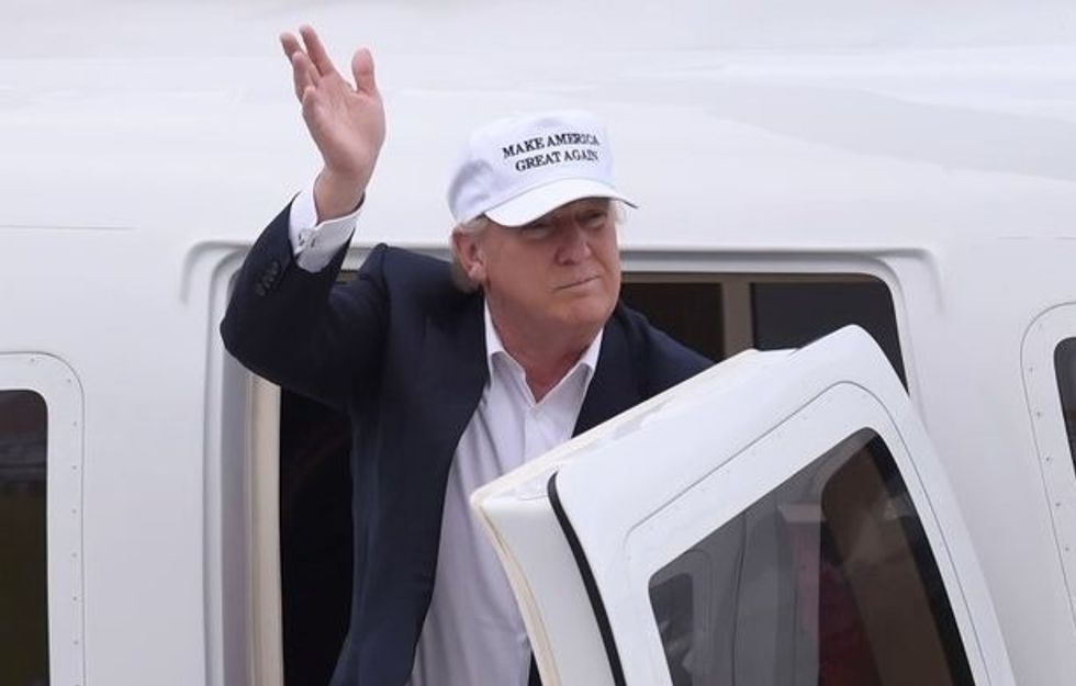 In Scotland, Trump Waves At Crowd Protesting His Racism