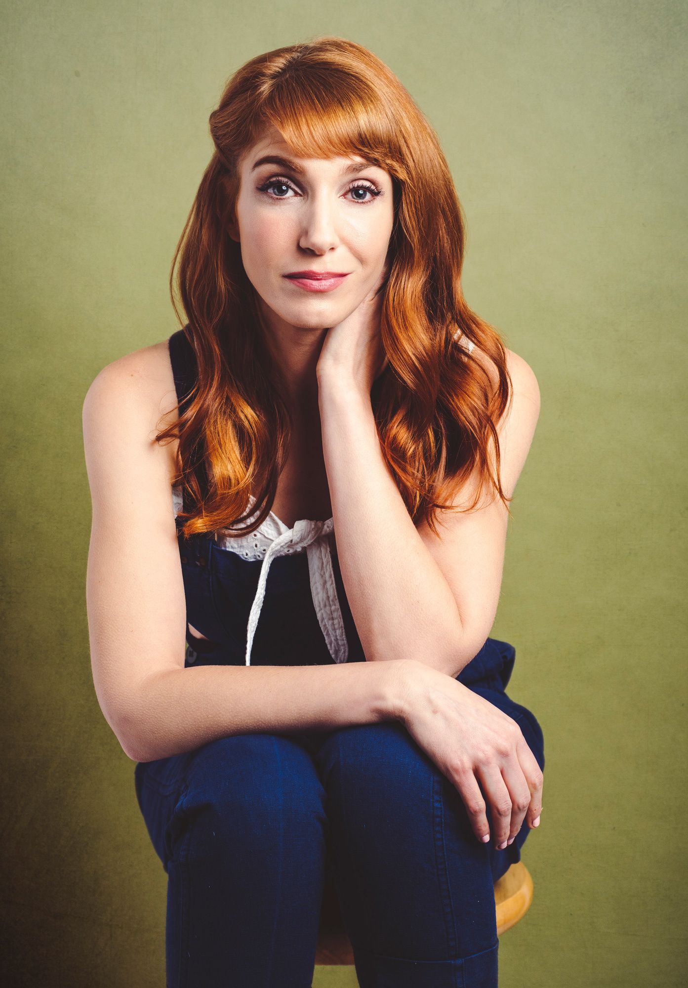 Actress Gwen Hollander from SHOWTIME series Kidding sitting on a stool.