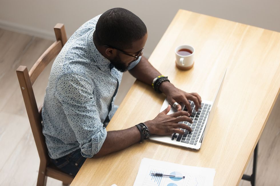 Man writing a cover letter during his job search