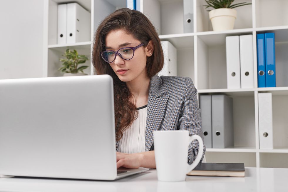 Professional woman writing a cover letter
