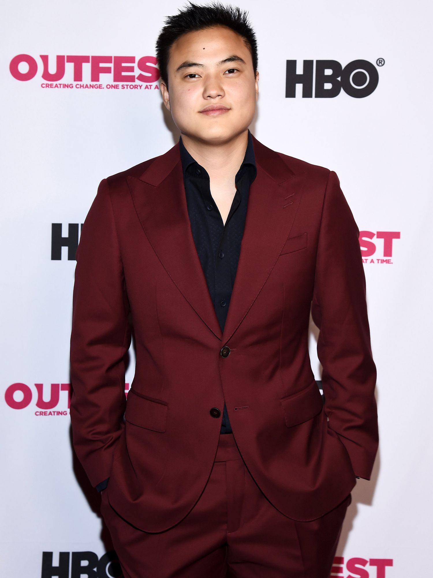 Leo Sheng in a burgundy suit.