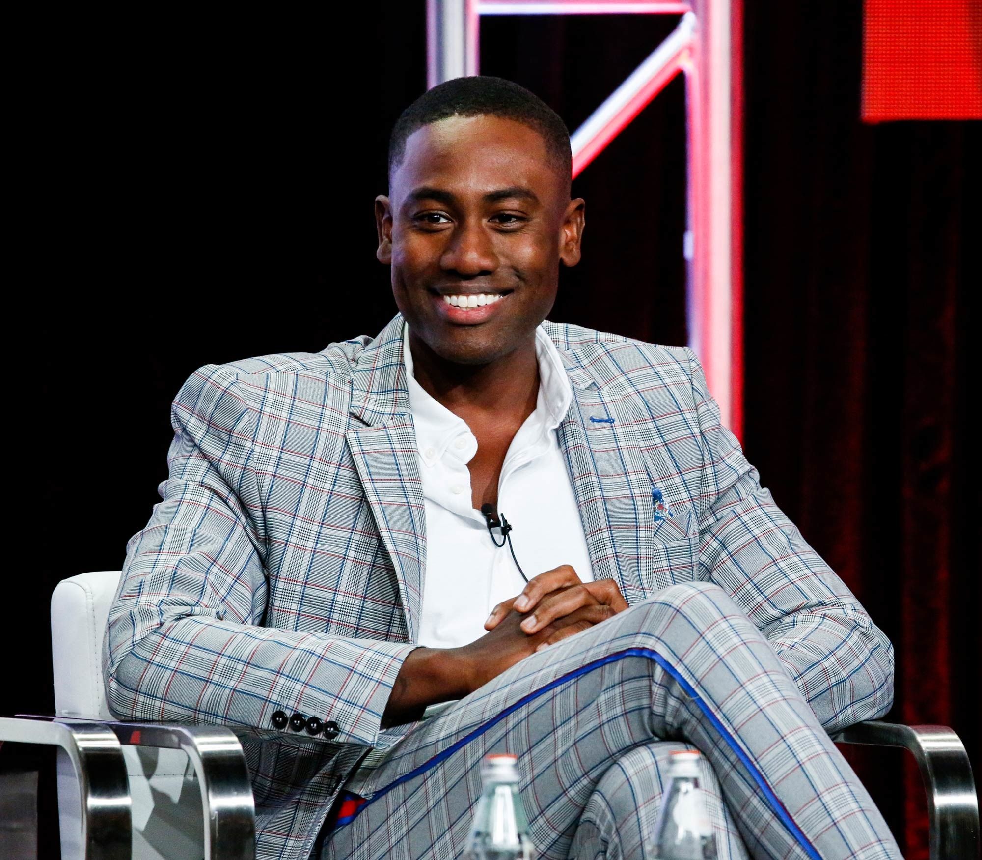 J. Alex Brinson in a gray plaid suit.