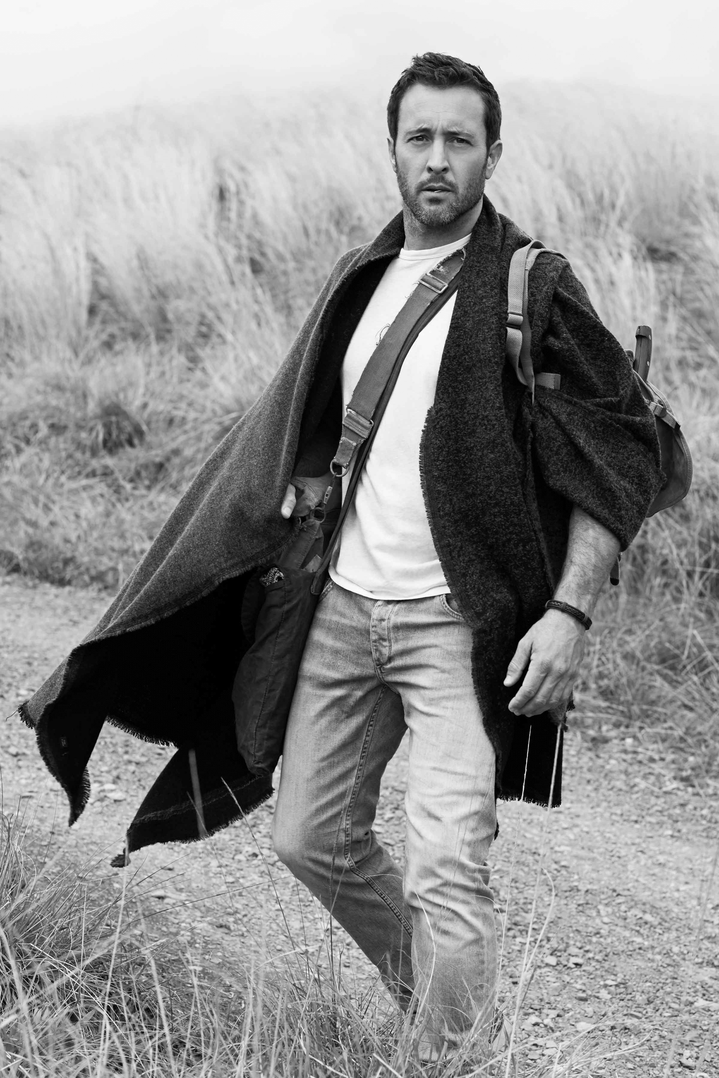 Black and white photo of Alex O'Loughlin hiking.