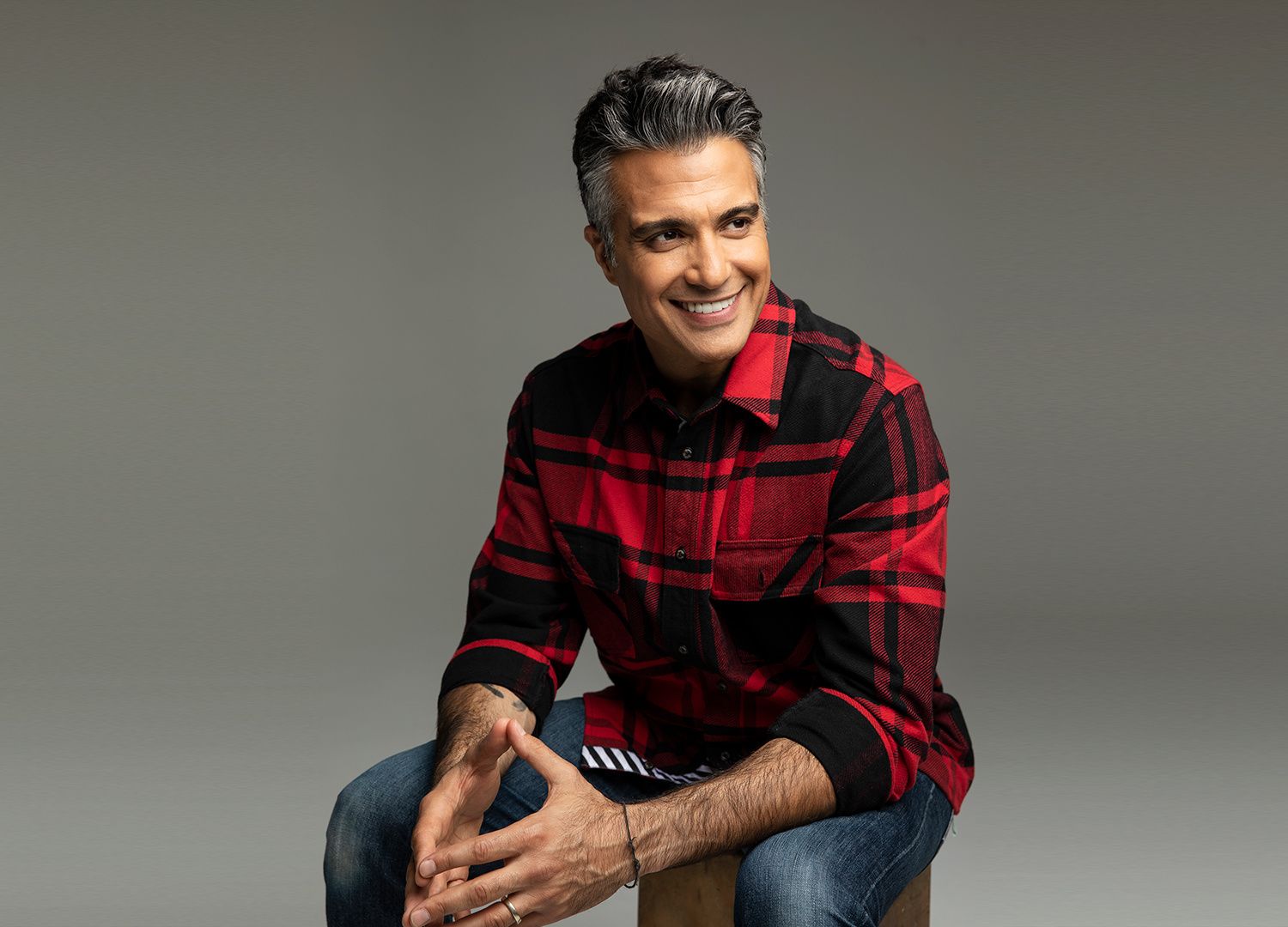 Actor Jaime Camil wearing a flannel.