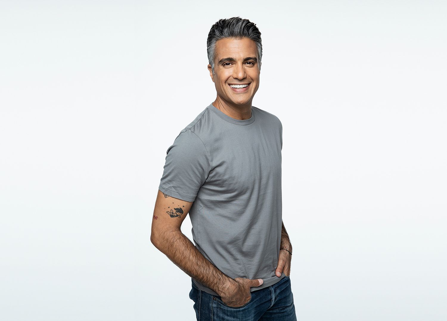 Actor Jaime Camil in a T-shirt and jeans.