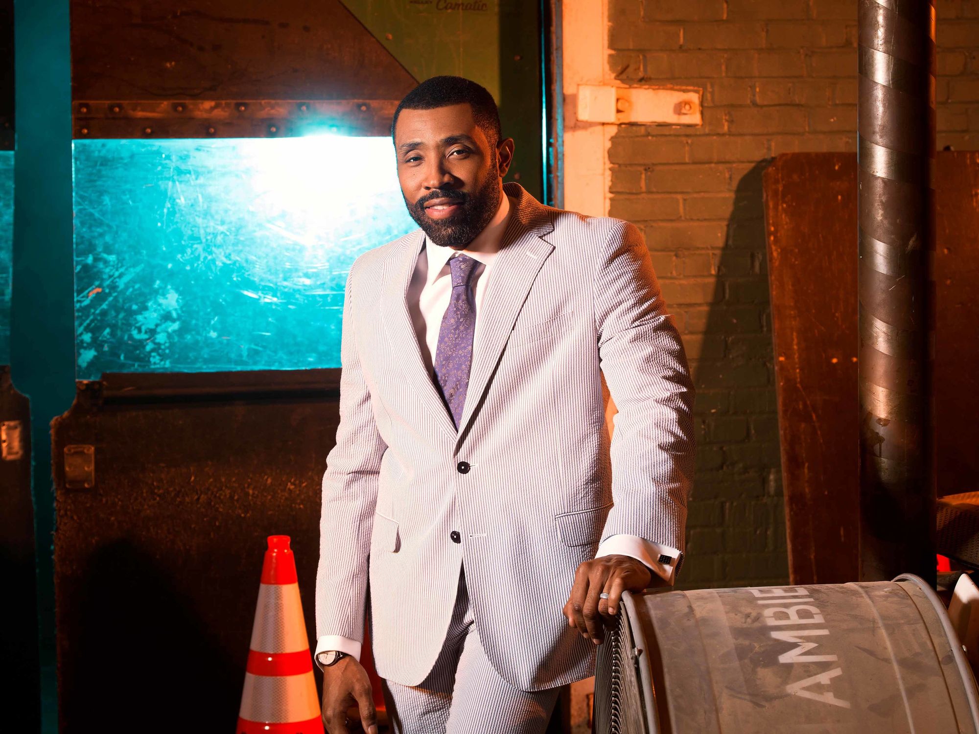 Cress Williams in a purple suit.