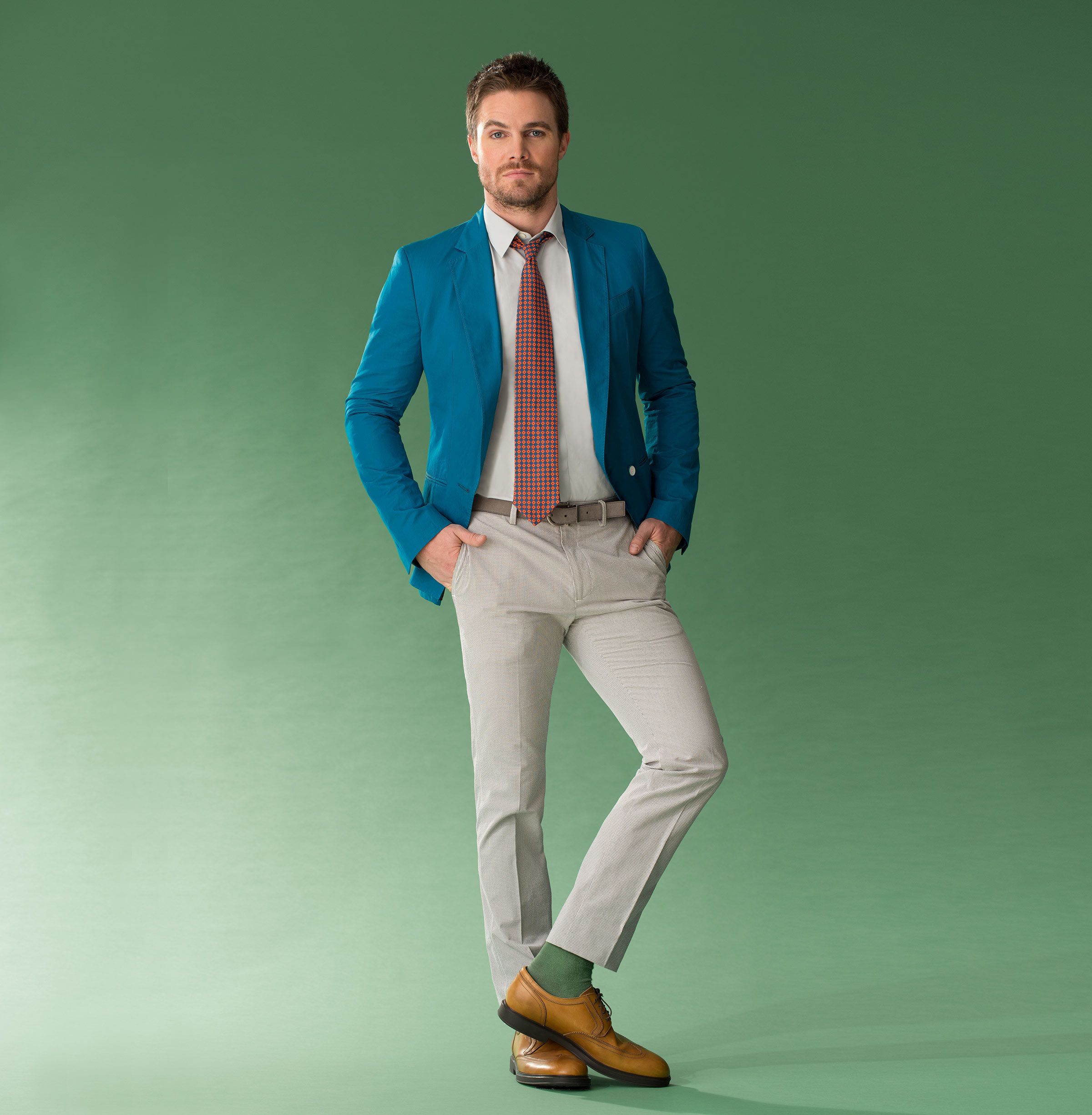 Actor Stephen Amell modeling a designer suit.