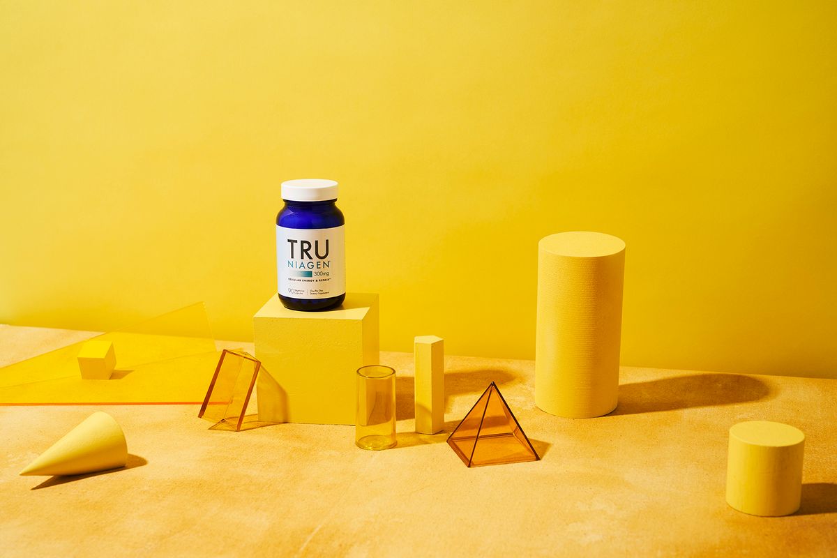 tru niagen bottle with yellow background