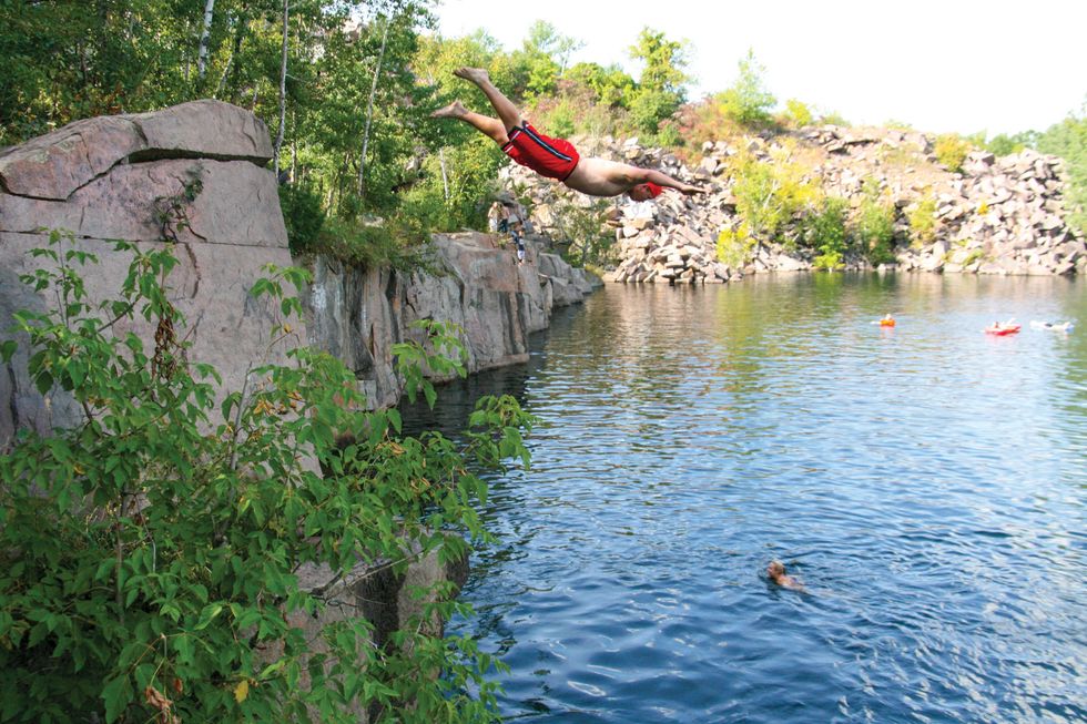 Man jumping into a quarry