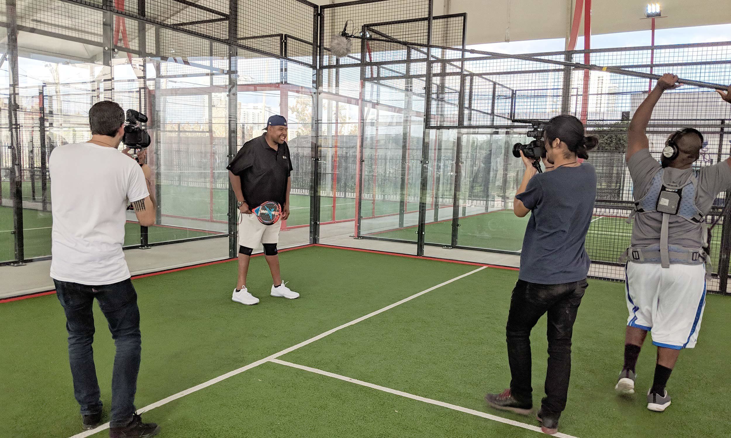 Actor Omar Miller on a squash court for a video/photo shoot.